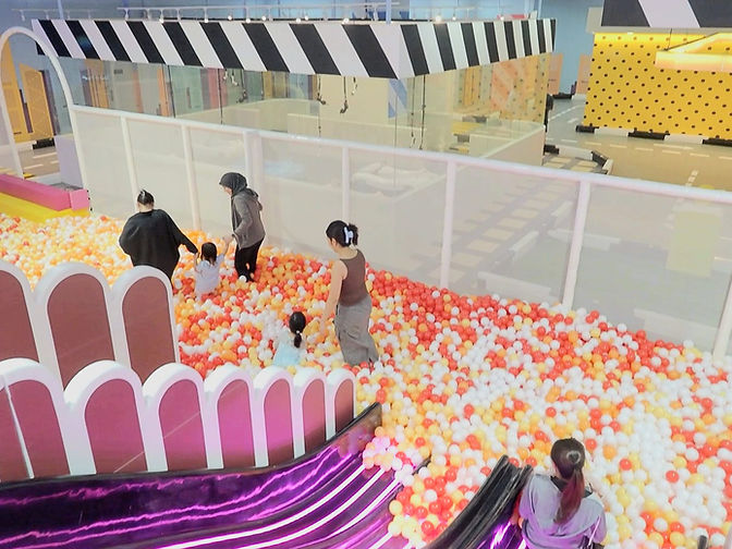 Families playing in the giant ball pit at VroomTown Malaysia