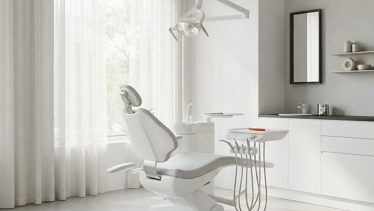 A bright, minimalist dental clinic room featuring a clean chair illuminated by soft, natural daylight filtering through sheer curtains.