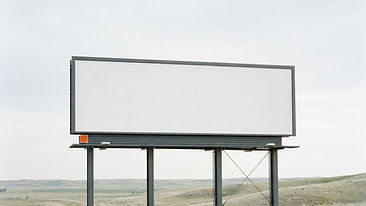 A clean, blank billboard standing against a clear sky in a minimalist composition.
