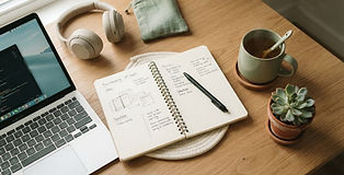 Desk with notebook and tea