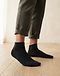 MATILEO Ankle Sock — Black (Black), worn or held by model
