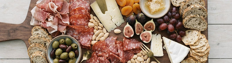 Artisanal charcuterie board on a timber table