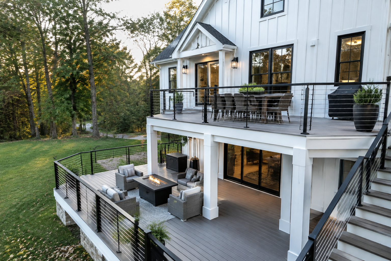 Two-level deck with black metal cable railings in modern farmhouse style