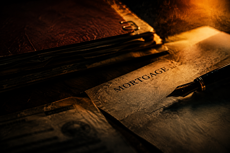 Close-up of legal documents and a pen near a signature line