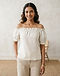 Ivory Off-Shoulder Top (Ivory), worn or held by model