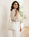 White Bucket Bag (White), worn or held by model