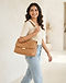 Camel Quilted Bag (Camel), worn or held by model