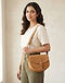 Camel Sling Bag (Camel), worn or held by model