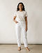 White Mom Jeans (White), worn or held by model