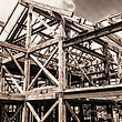 Structural steel frame of a modern commercial building under construction against a clear Alberta sky