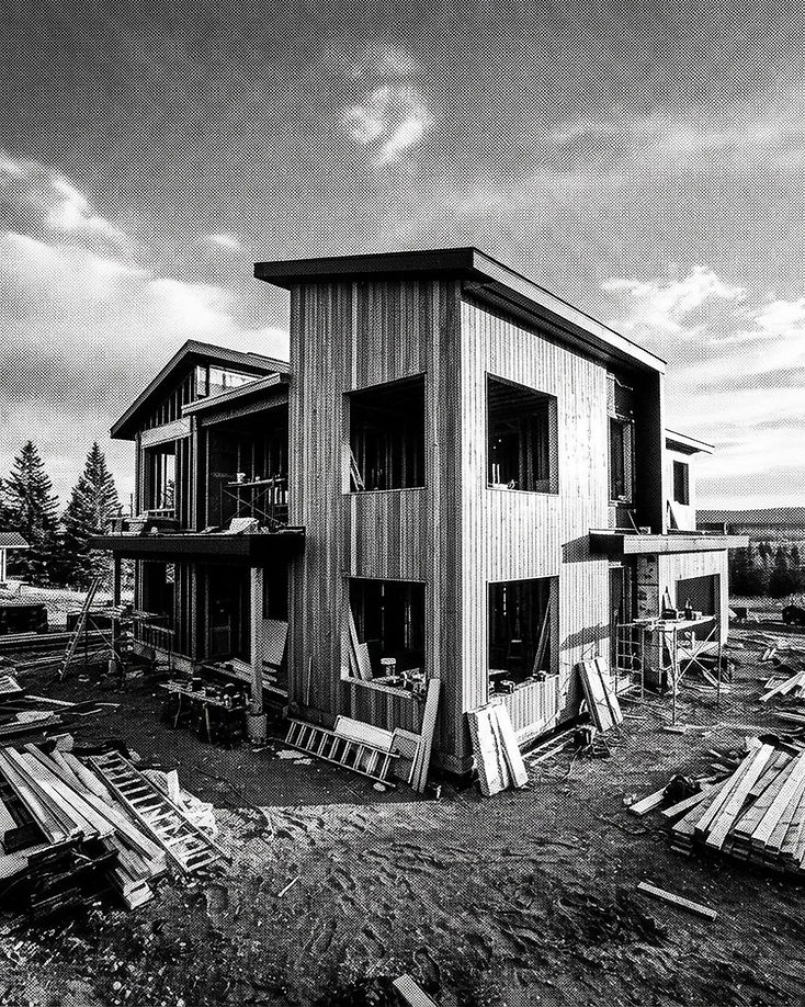 Contemporary residential construction in Alberta with cedar and steel detailing at golden hour