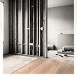 Finished open-plan renovation with warm oak flooring and matte black window frames