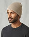 Unisex Cotton Blend Knit Beanie — Beige (Beige), worn or held by model