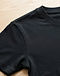 Unisex Essential Cotton Blend Tee — Black (Black), detail close-up