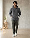 Unisex Fleece Plain Hoodie — Charcoal (Charcoal), worn or held by model