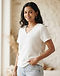 Unisex Fleece V-Neck Tee — White (White), worn or held by model