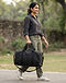 Unisex Cotton Blend Everyday Duffel Bag — Black (Black), worn or held by model