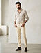 Men's French Terry Stretch Slim Jeans — Cream (Cream), worn or held by model