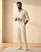 Men's French Terry Pleated Trousers — Cream (Cream), worn or held by model