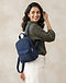 Unisex Canvas Mini Backpack — Navy (Navy), worn or held by model
