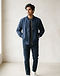 Unisex Canvas Bomber Jacket — Navy (Navy), worn or held by model