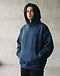 Unisex Oversized Canvas Hoodie — Navy (Navy), worn or held by model