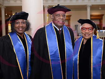 Honorary degree recipients in doctoral regalia at a TIUAC conferral