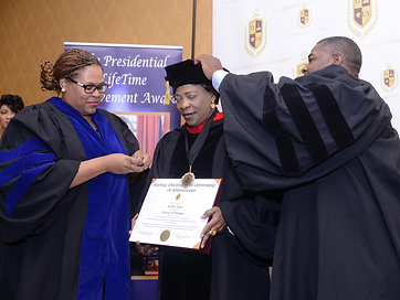 Doctoral hooding and cap placement during the TIUAC degree conferral