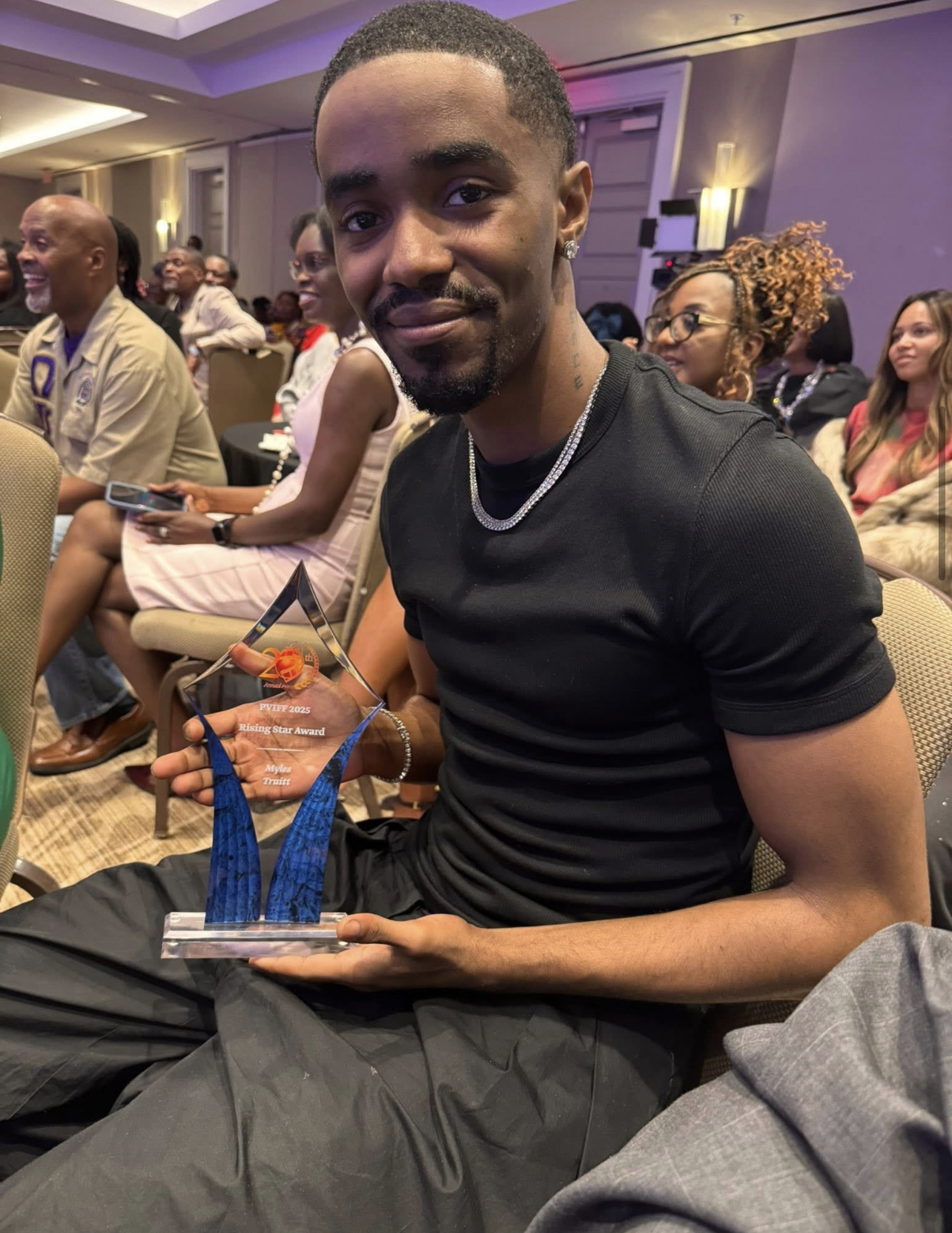 Myles Truitt holding the PVIFF 2025 Rising Star Award