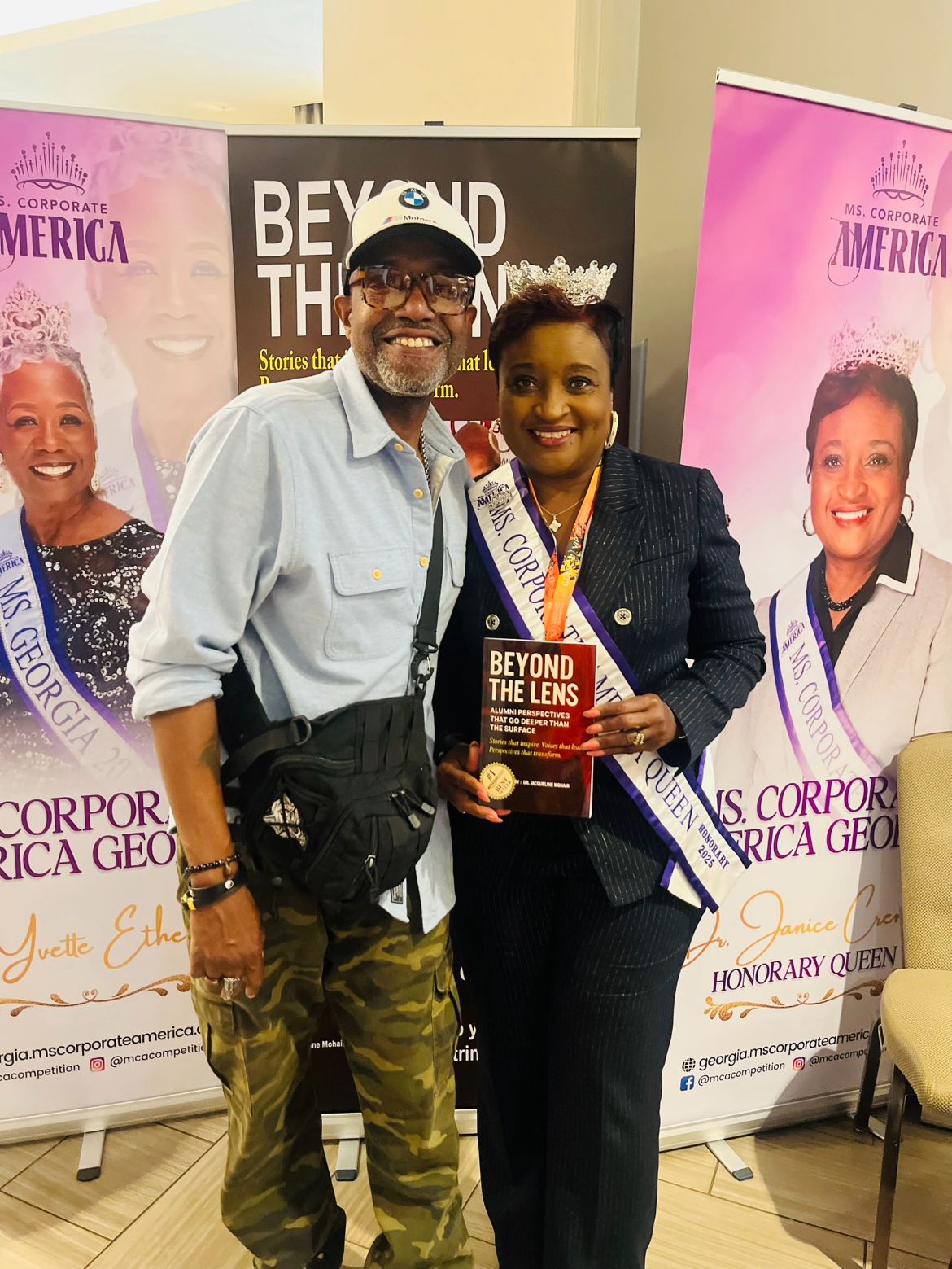 Guest with Ms. Corporate America Honorary Queen 2025 holding the Beyond the Lens book