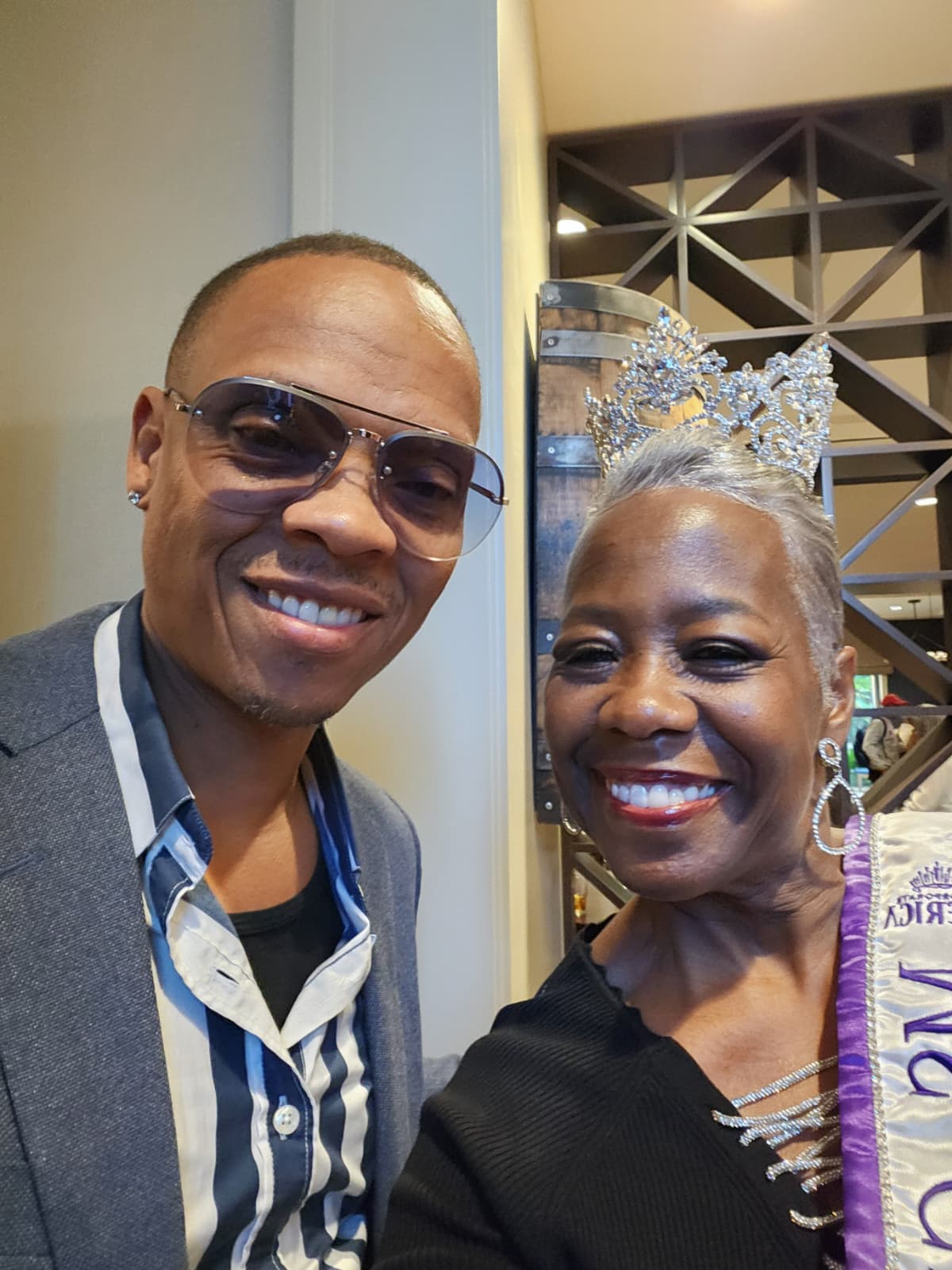 Guest posing with Ms. Georgia 2025 at the celebration