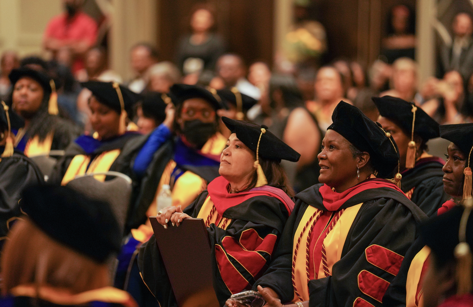 TIUAC graduates gathered in caps and gowns at commencement