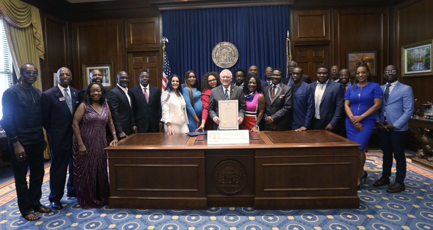 TIUAC delegation recognized with a framed proclamation in the Georgia State Capitol office