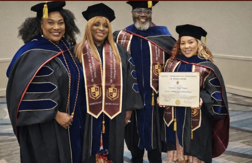 TIUAC doctoral graduates in regalia with a conferred degree
