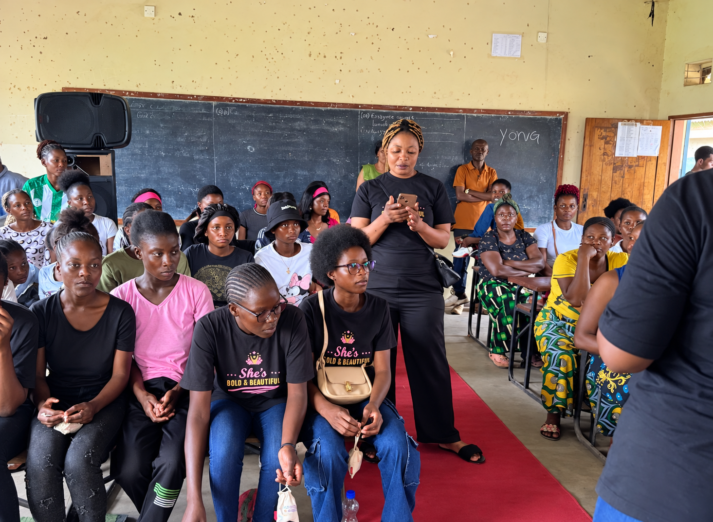 Young women seated in an empowerment workshop session