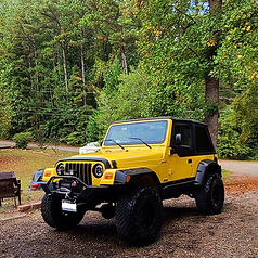 Yellow Jeep Wrangler Sport after a full detail