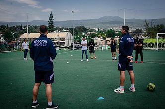 Coaches directing participants on the ID Talent 2 field