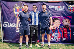 Tres personas posando frente al banner del Levante UD International Cup