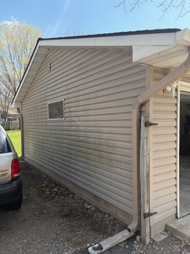 Garage siding wash — before