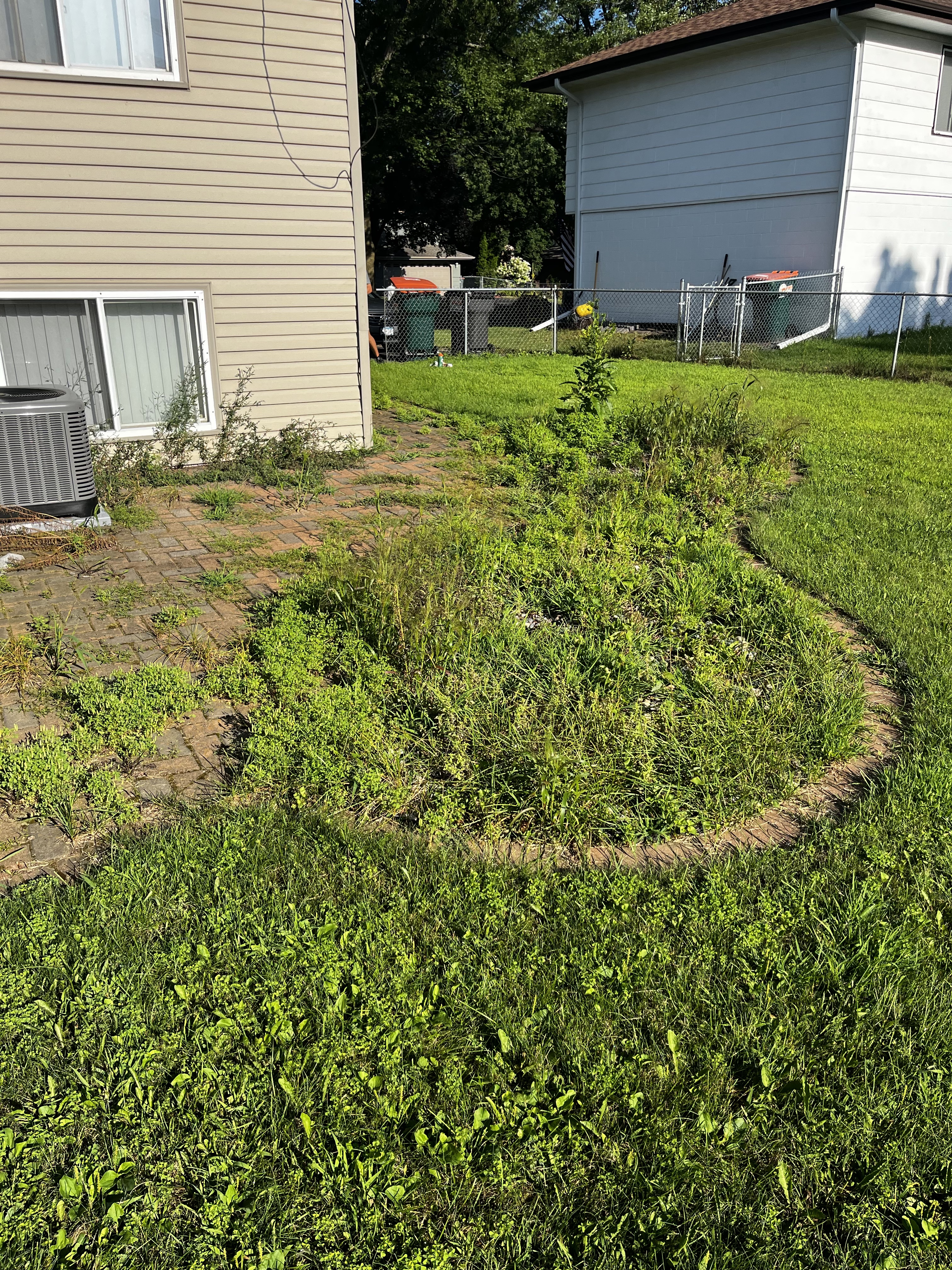 Paver patio & landscape bed — before