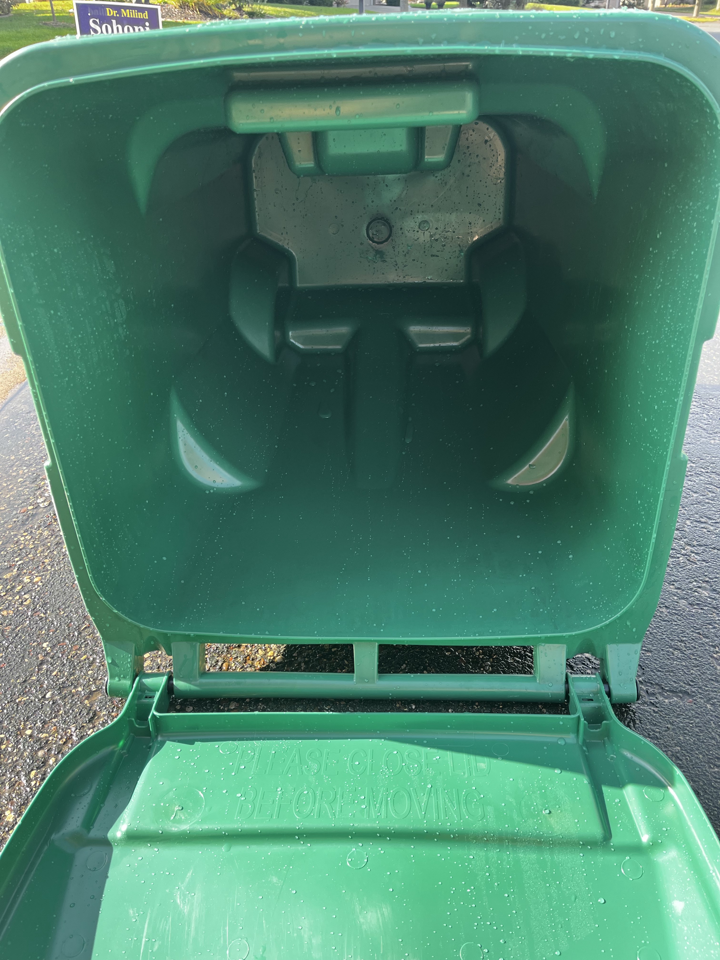 Green garbage bin cleaning — after