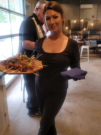 Khristi Levack serving appetizers at an event