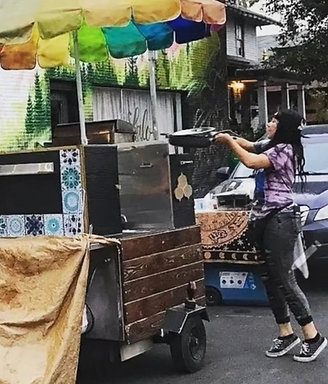 Liberty cooking at the original Disco Kitchen food cart
