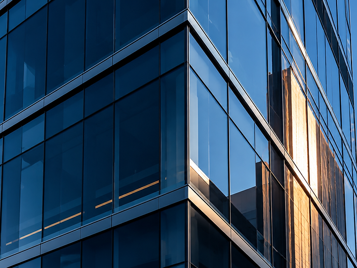 Reflective glass and steel facade of a modern commercial building