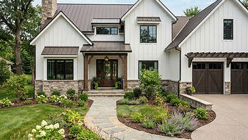 Farmhouse-style home with new board-and-batten siding and stone accents