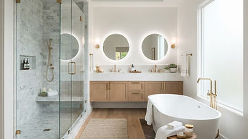 Remodeled bathroom with walk-in tile shower, freestanding tub and double vanity