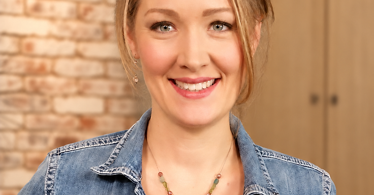 Erin, craniosacral therapist, in a sunlit studio