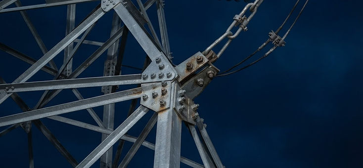 Close-up technical detail of steel lattice transmission structure
