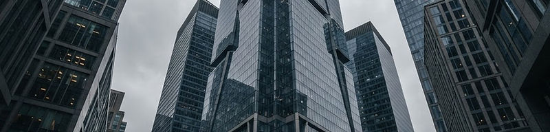 Glass and stone office towers in a financial district