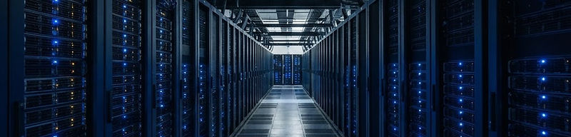 Aisle of server racks with cool indicator lighting in a data centre